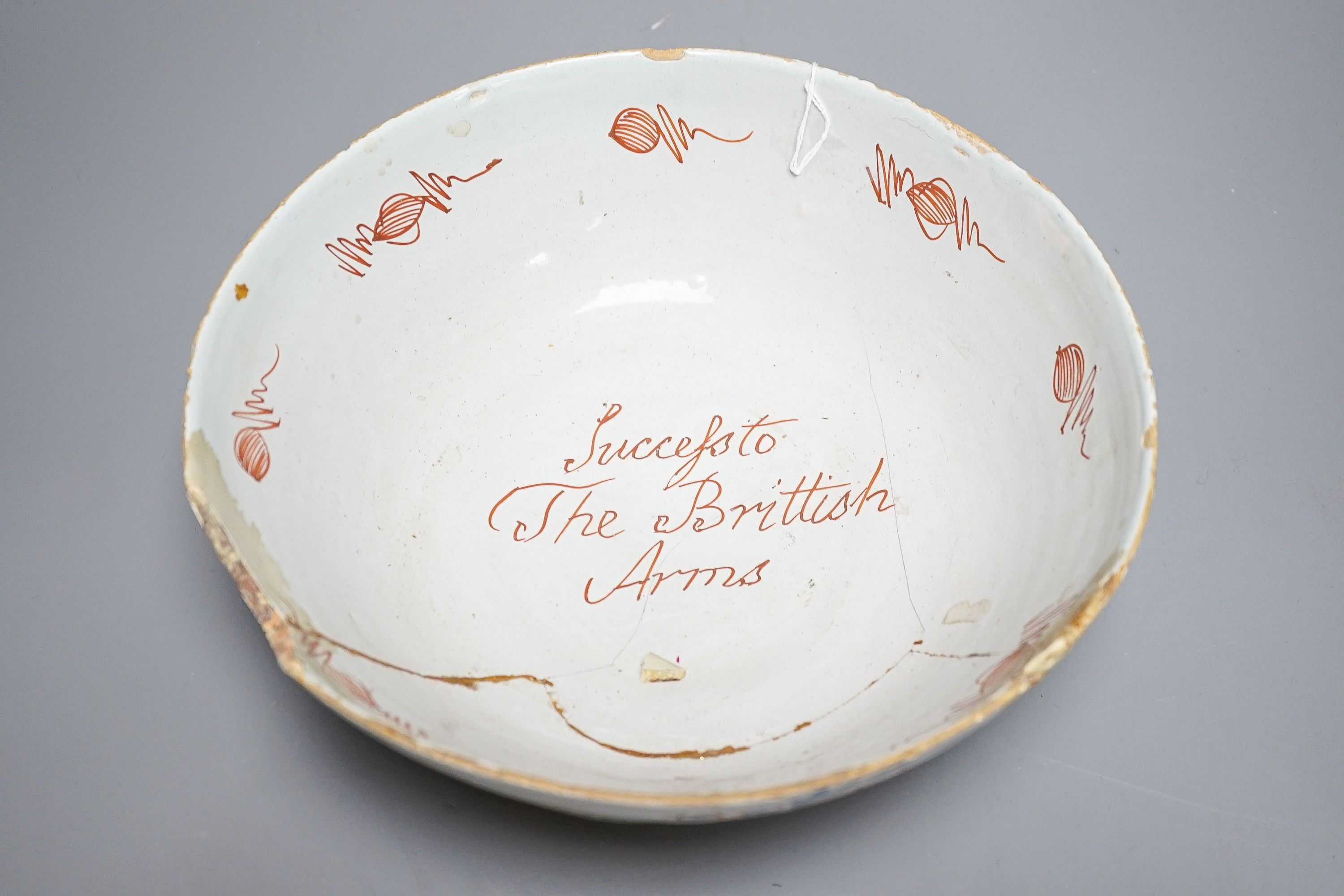 An 18th century English polychrome delftware bowl, interior inscribed 